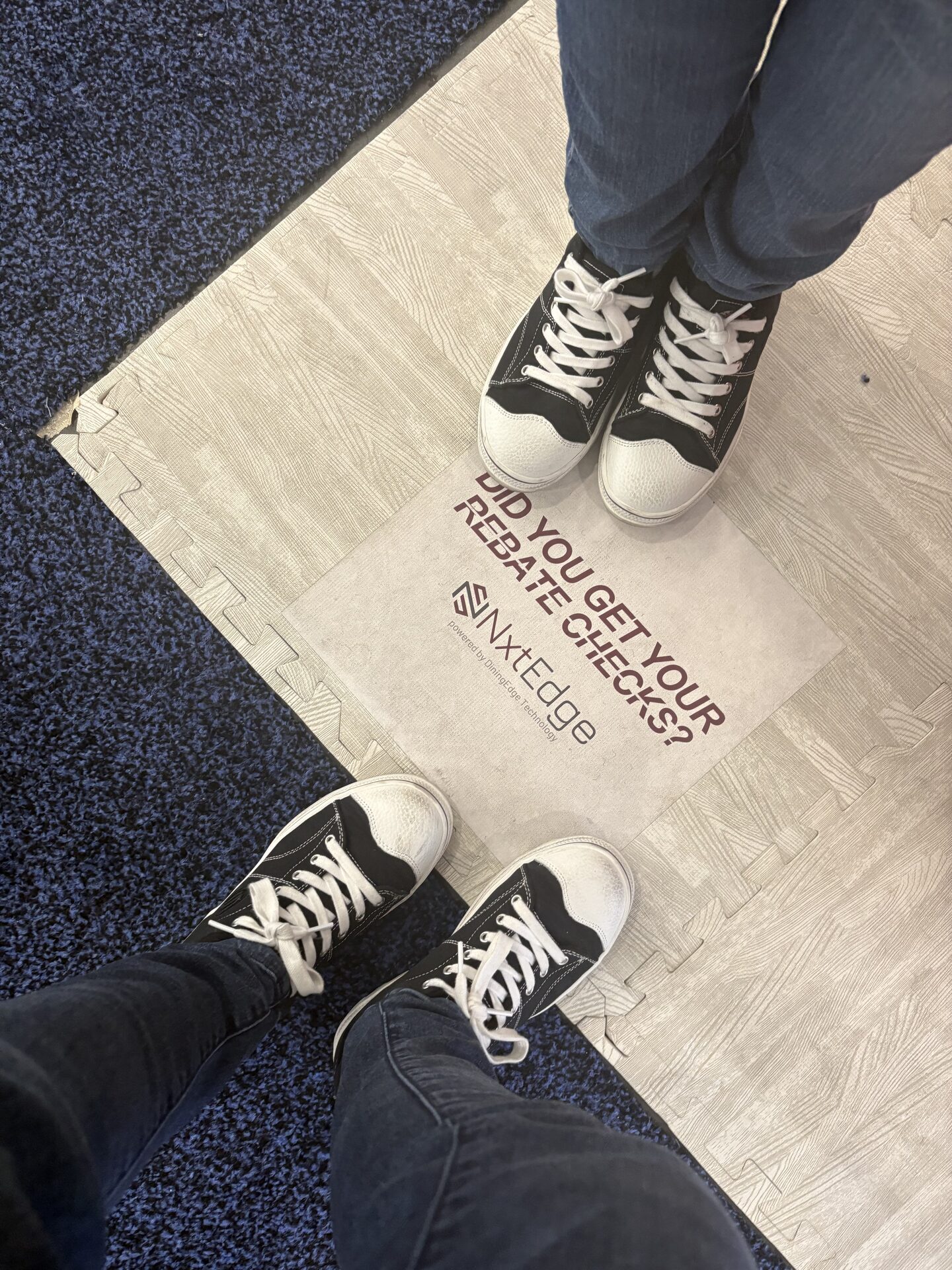 NxtEdge rebate-checks floor decal at the Boston Restaurant & Bar Show booth