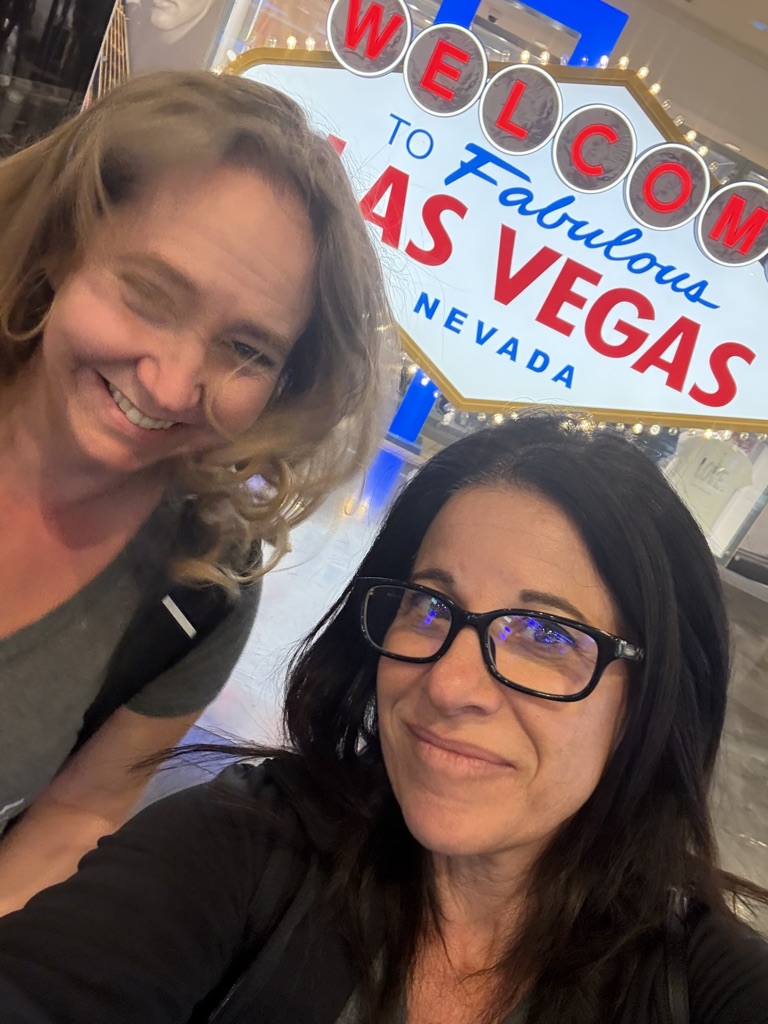 NxtEdge team at the Welcome to Las Vegas sign during Pizza Expo week